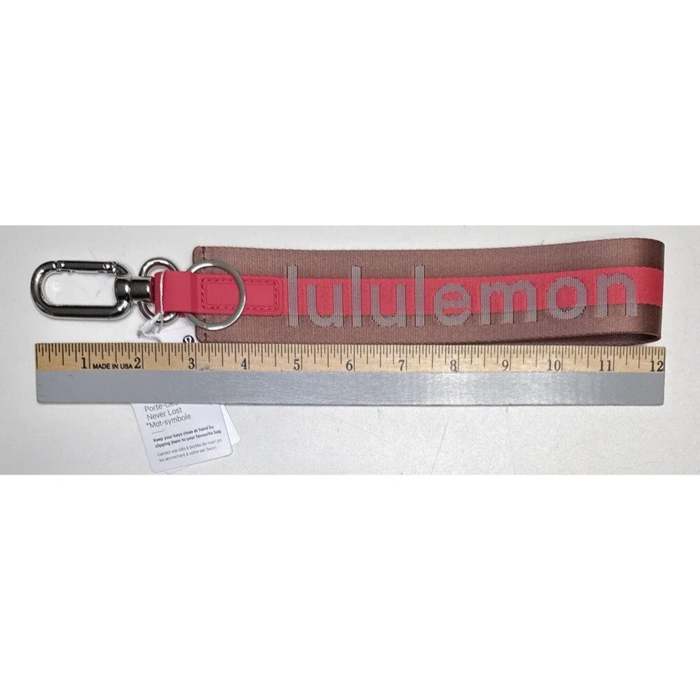 Lululemon Never Lost Keychain Wordmark Brown Pink One Size NWT